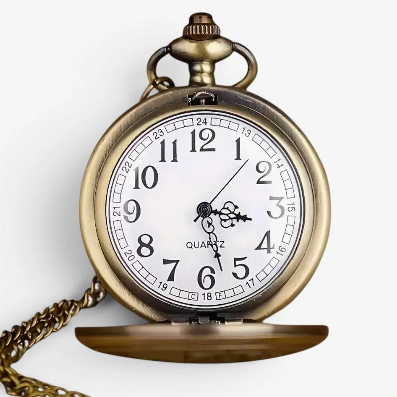Antique brass-finished elephant pocket watch with white dial, black arabic numerals, and matching chain