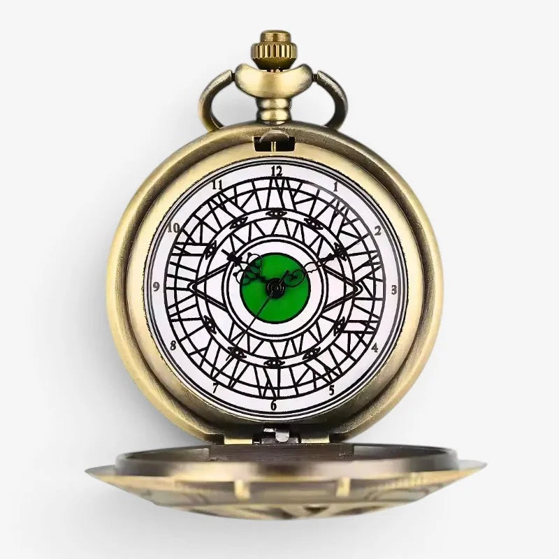Antique brass-finished eye of agamotto pocket watch with white face black roman numerals and green geometric center