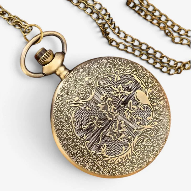 Fantasy pocket watch antique brass pocket watch with intricate floral and bird engravings on its circular face attached chain