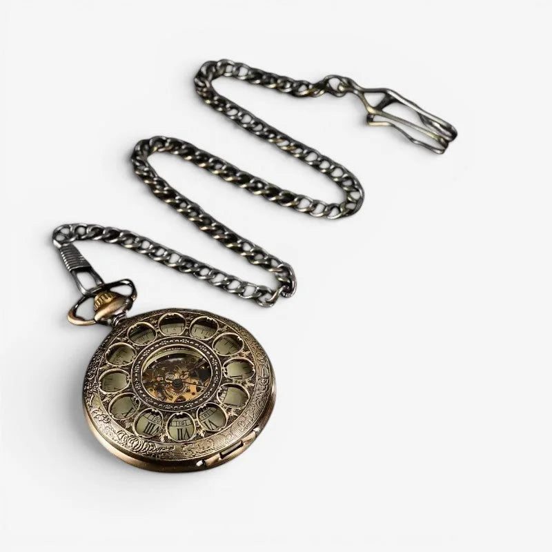 Antique brass french pocket watch with intricate floral engraving roman numeral markers and visible mechanical movement