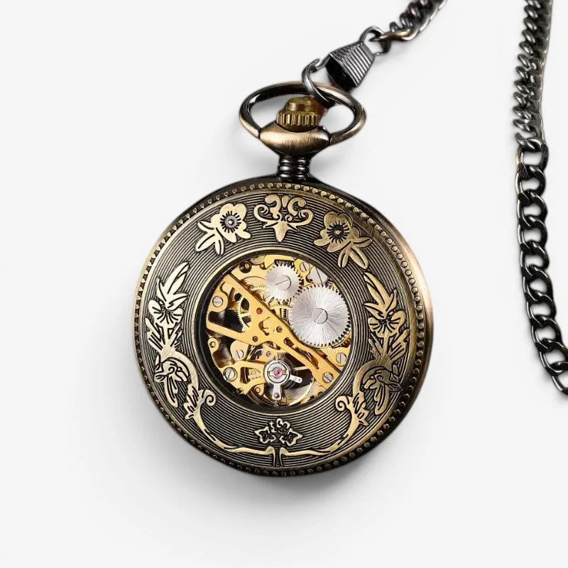 Antique-style french pocket watch in brass with intricate floral engravings and exposed golden gears