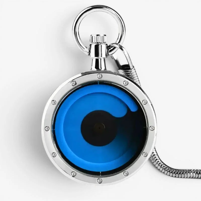 Silver-toned futuristic pocket watch with a vibrant blue liquid-filled face and black center in a metal frame secured by screws