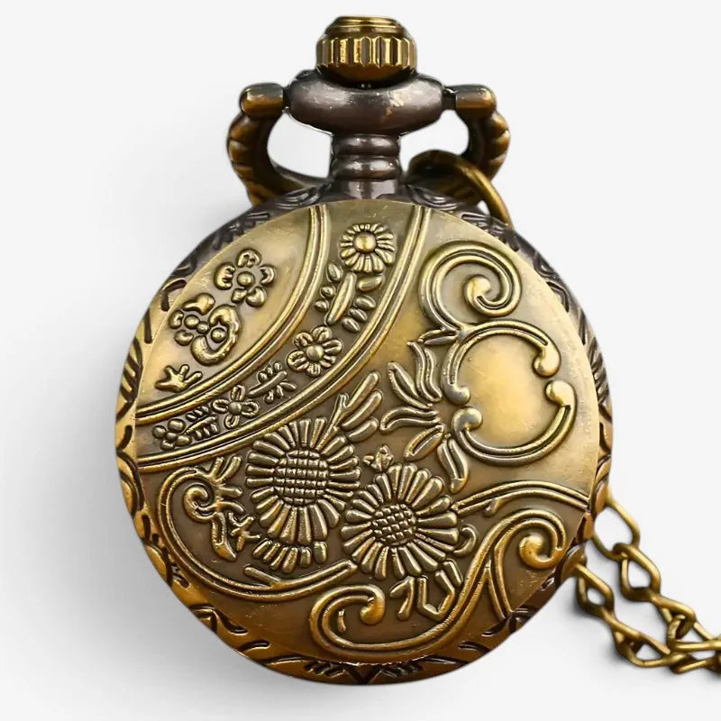 Gold pocket watch necklace with antique brass finish intricate floral scrollwork engraving decorative crown and chain