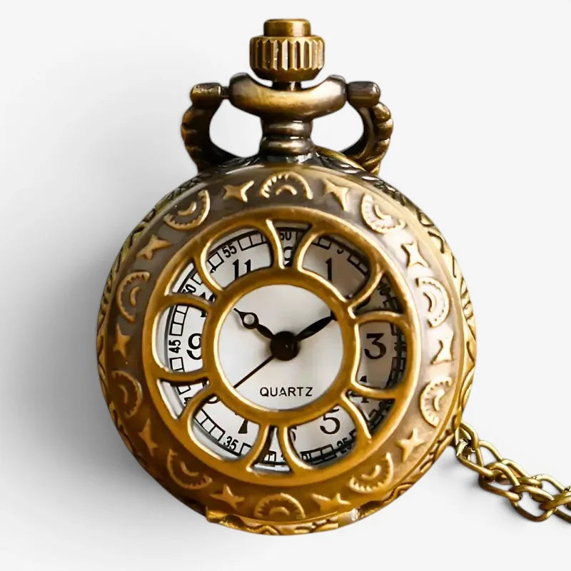 Gold pocket watch necklace featuring an antique-style brass pocket watch with star and moon motifs and quartz dial