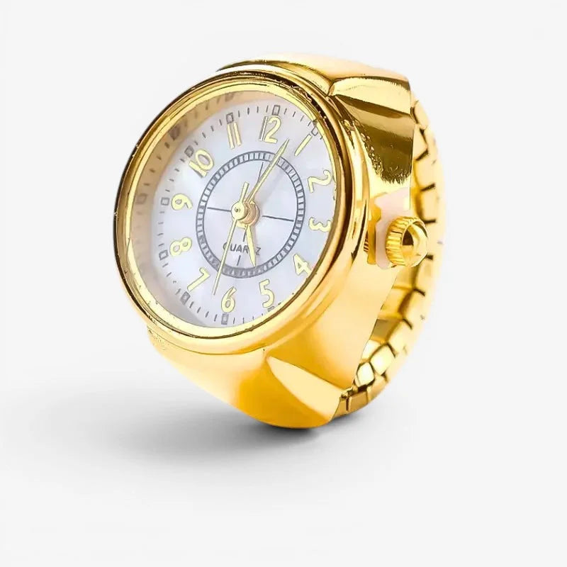 Gold ring watch with a white face gold numerals and hands and a textured gold-toned metallic band