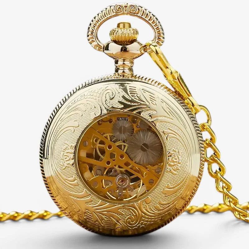 Gold sun pocket watch with intricate floral engraving and visible mechanical gears on gold chain