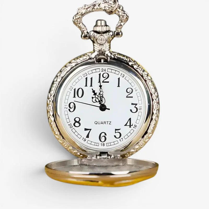 Silver ornate golden eagle pocket watch with white face black numerals and intricate engraved case