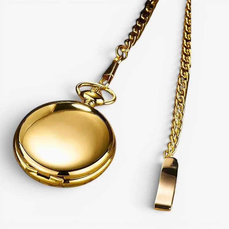 Golden mechanical pocket watch with polished round gold case and attached gold-toned chain for classic timekeeping