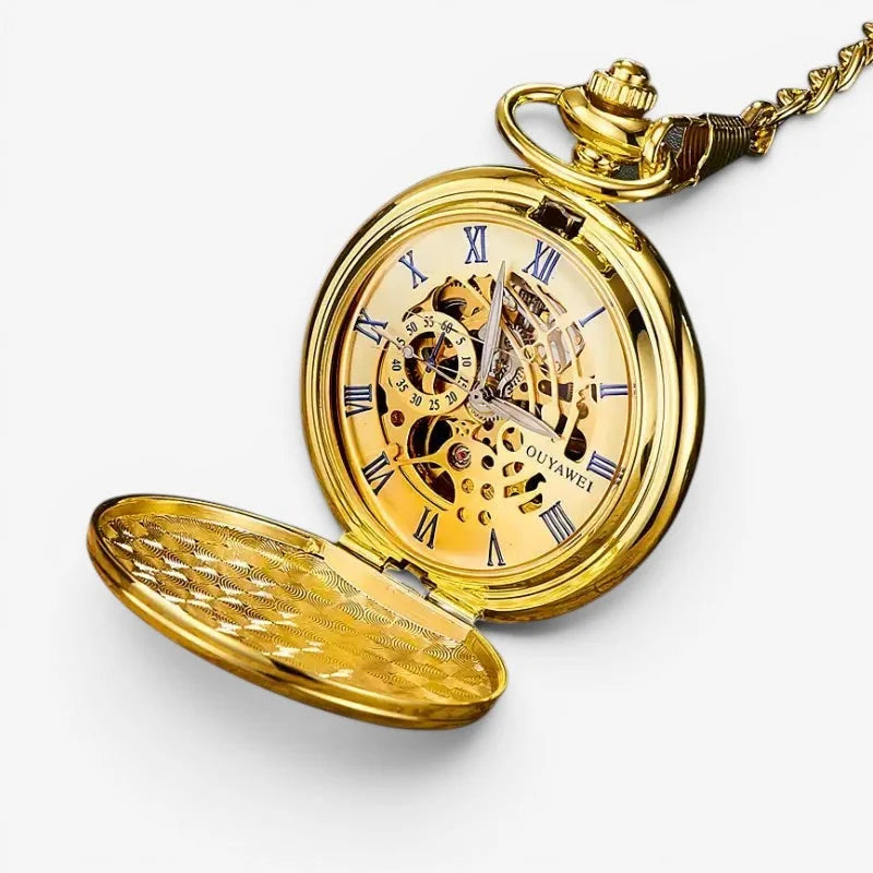 Golden mechanical pocket watch with roman numerals visible mechanical movement and ornate gold chain attachment