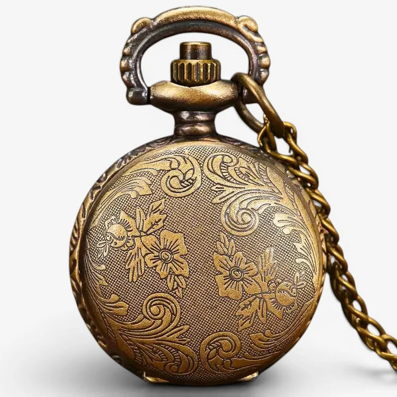 Antique brass green owl pocket watch with intricate floral engravings and a decorative chain