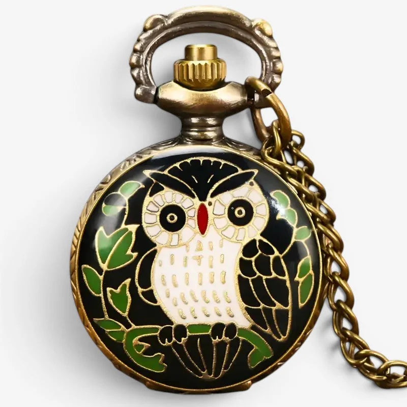 Antique-style brass green owl pocket watch featuring enamel owl design with gold detailing on a black background