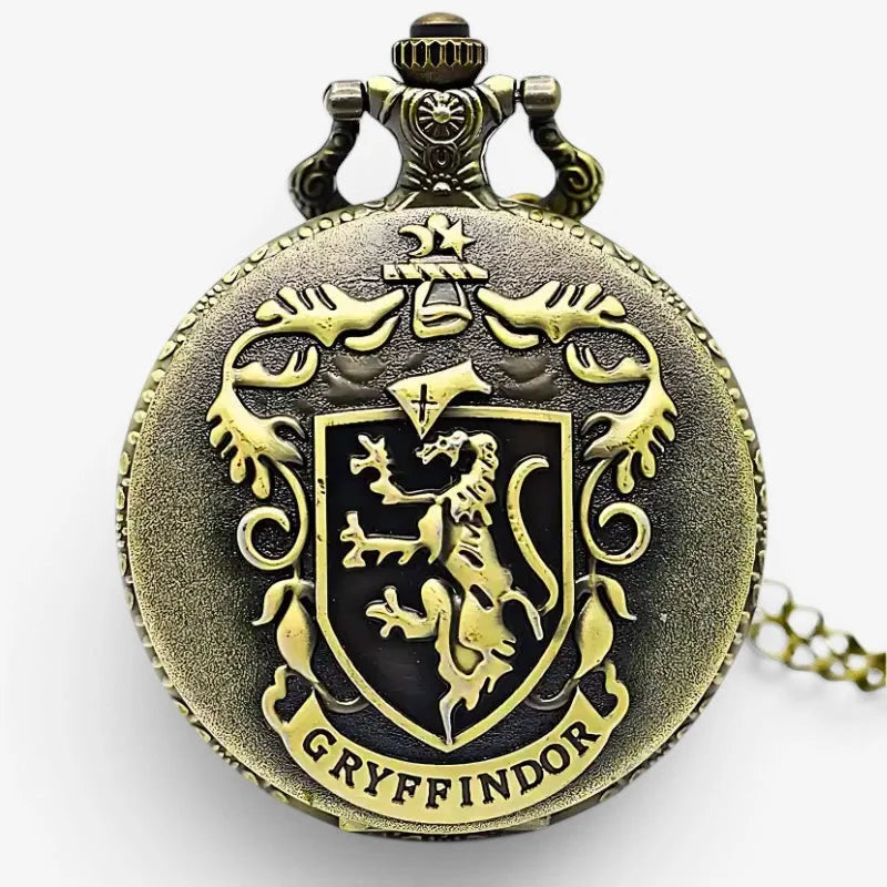 Antique brass-colored gryffindor pocket watch with detailed crest and gryffindor engraving on the face