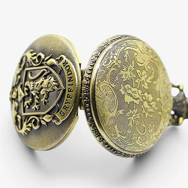 Antique brass grffindor pocket watch with intricate floral engraving and Gryffindor crest on lid