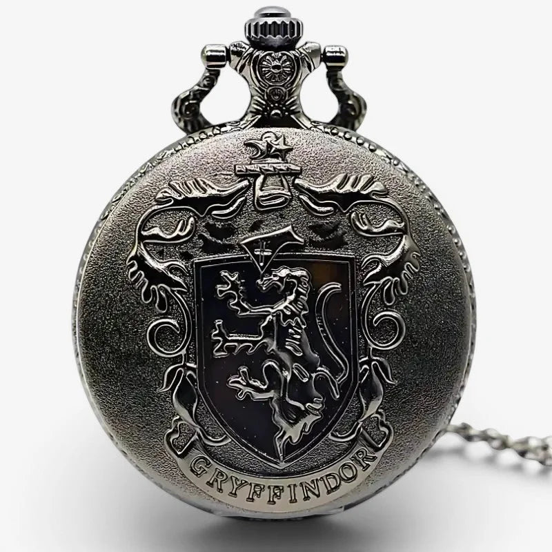Antique silver-toned gryffindor pocket watch with detailed lion emblem and ornate crown above the shield