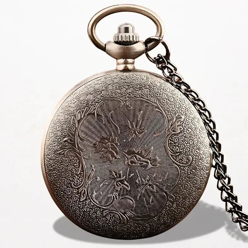 Antique bronze-finished harry potter pocket watch with intricate floral and dragon engraving on circular face and chain