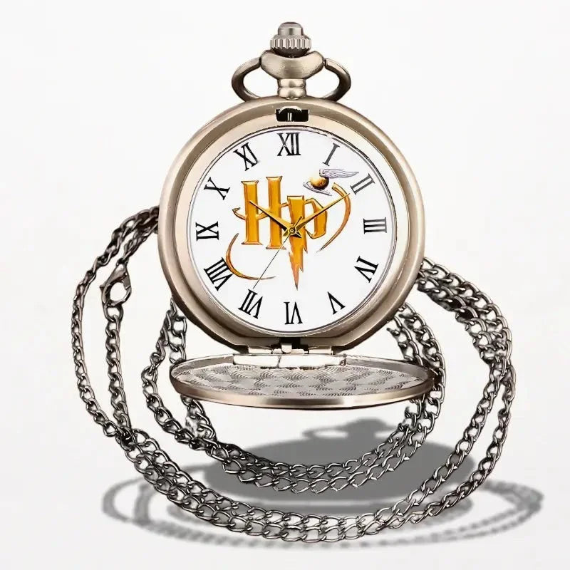 Antique silver-toned harry potter pocket watch with white face roman numerals and golden hogwarts crest logo