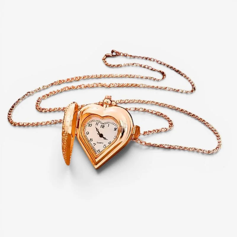 Rose gold heart pendant watch with a white face black numerals and matching rose gold chain
