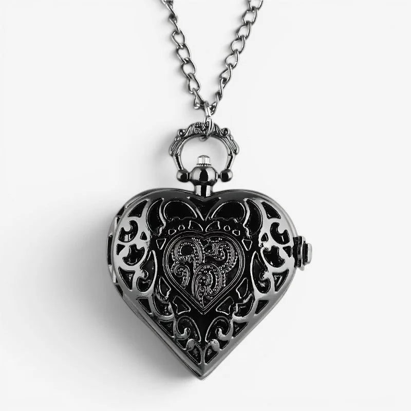 Black heart shaped pocket watch with intricate filigree detailing and silver toned chain for stylish timekeeping