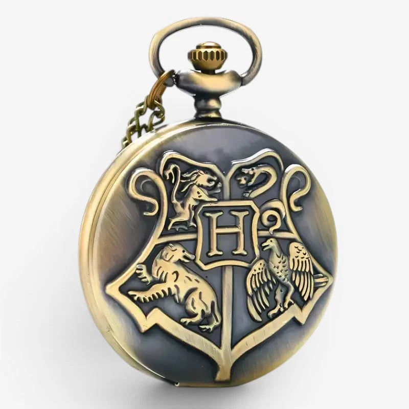 Antique brass-finished hogwarts pocket watch with a dark gray dial featuring embossed golden house crests
