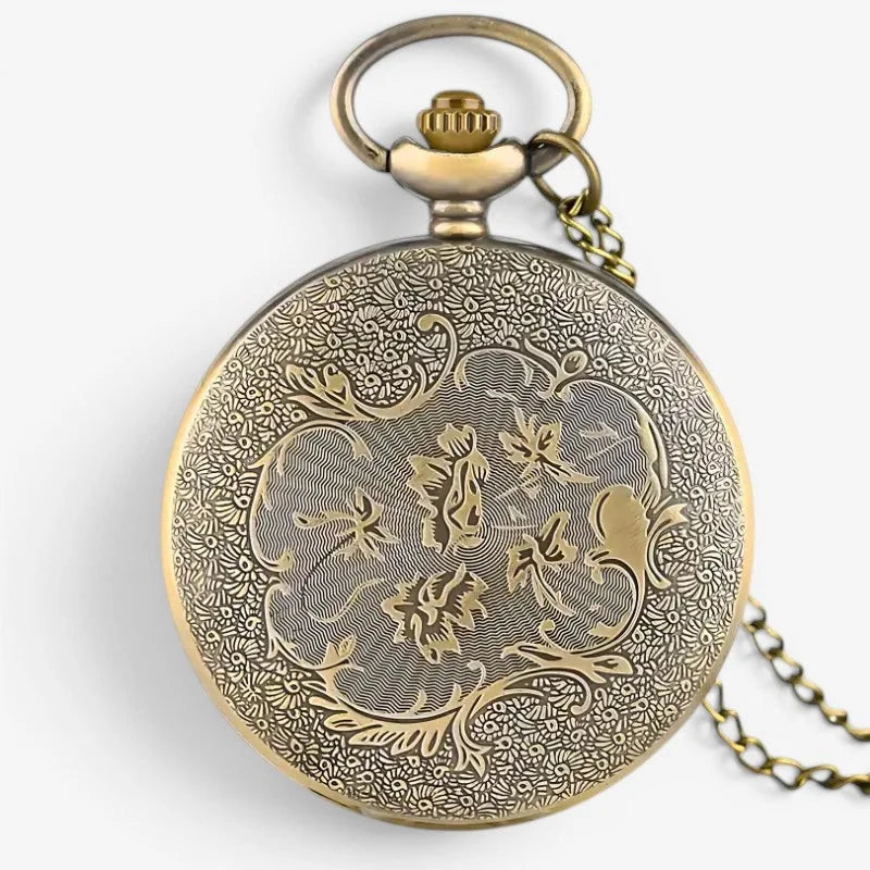 Antique brass hogwarts pocket watch with intricate floral engraving and delicate chain for vintage style use