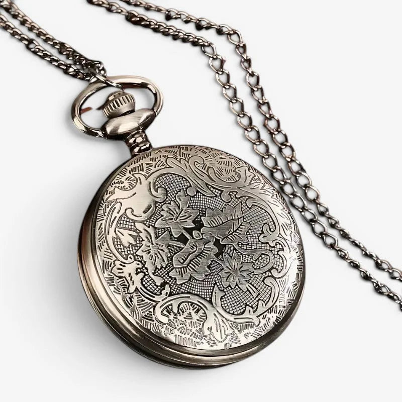 Horoscope pocket watch antique silver-toned with intricate floral and scrollwork engraving on circular face suspended from chain