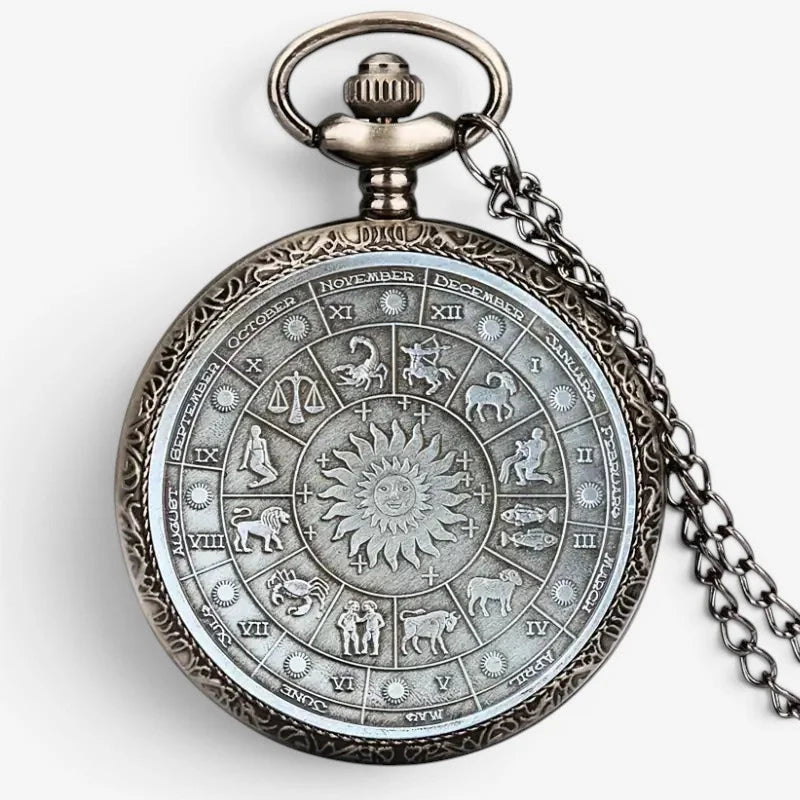 Antique silver-toned horoscope pocket watch with intricate zodiac and sun design and detailed wearable chain