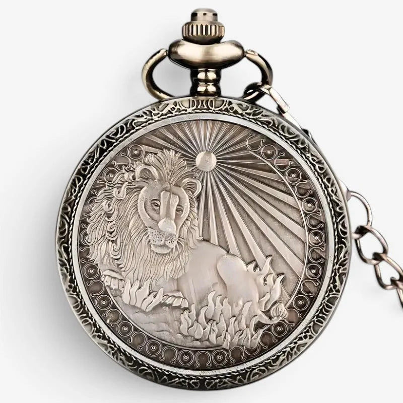 Antique silver-toned horoscope pocket watch with intricate engraved lion design and sunburst pattern on its face