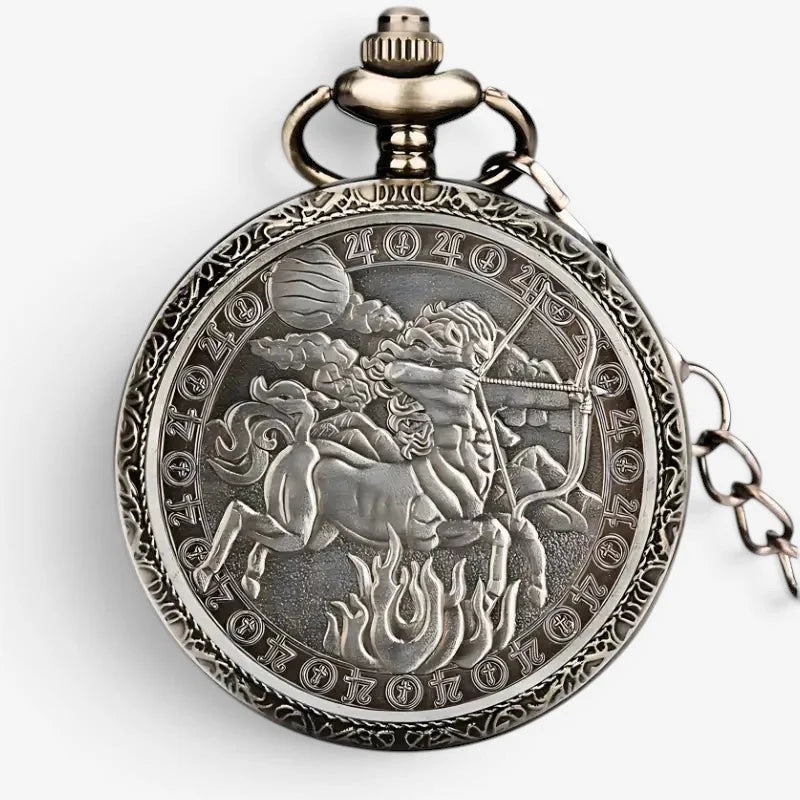 Antique silver-toned horoscope pocket watch with intricate centaur archer engraving and zodiac symbols on the back side