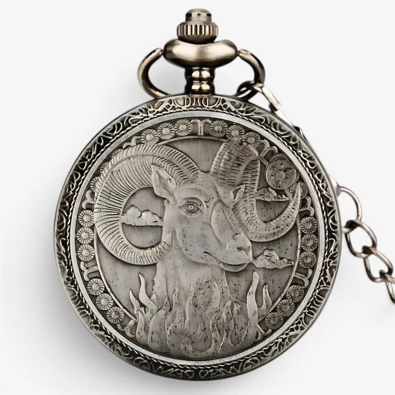 Antique silver-toned horoscope pocket watch with an intricately engraved aries ram design and celestial motifs