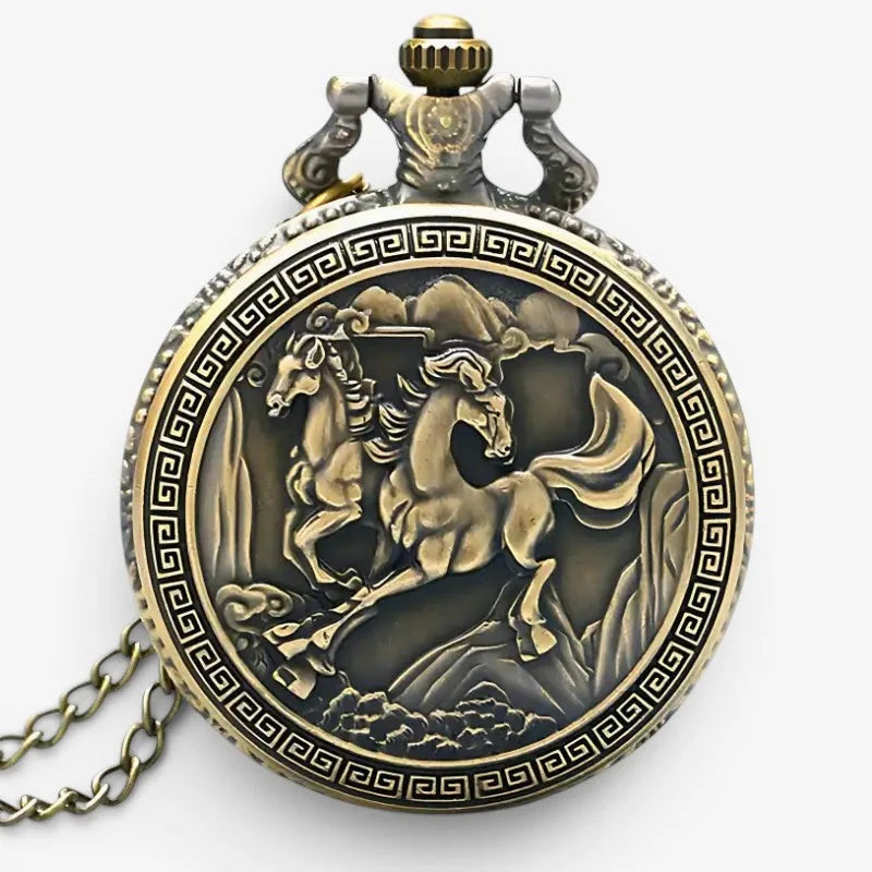 Antique brass horse pocket watch with detailed relief of galloping horses and greek key pattern border on its face