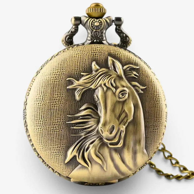 Antique brass horse pocket watch with detailed horse head relief and ornate vintage-style clasp on textured surface