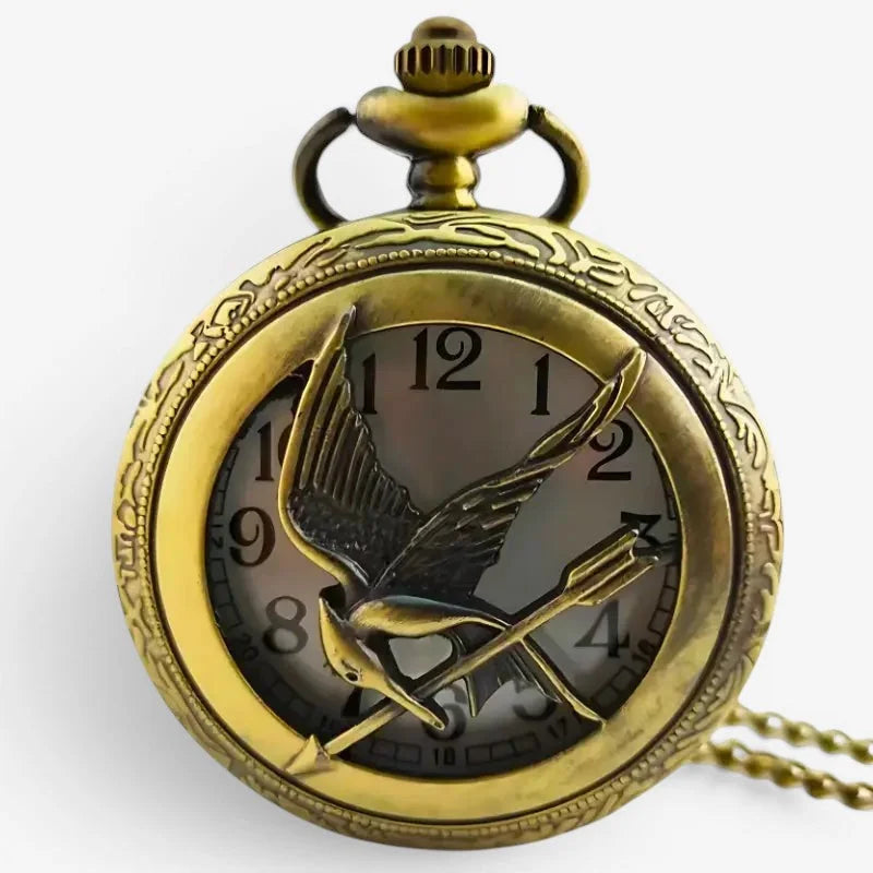 Antique brass-finished hunger games pocket watch with detailed bird and arrow emblem on the face
