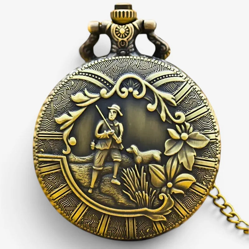 Antique brass hunter pocket watch with intricate engraved hunter and dog design amidst floral motifs on the back side