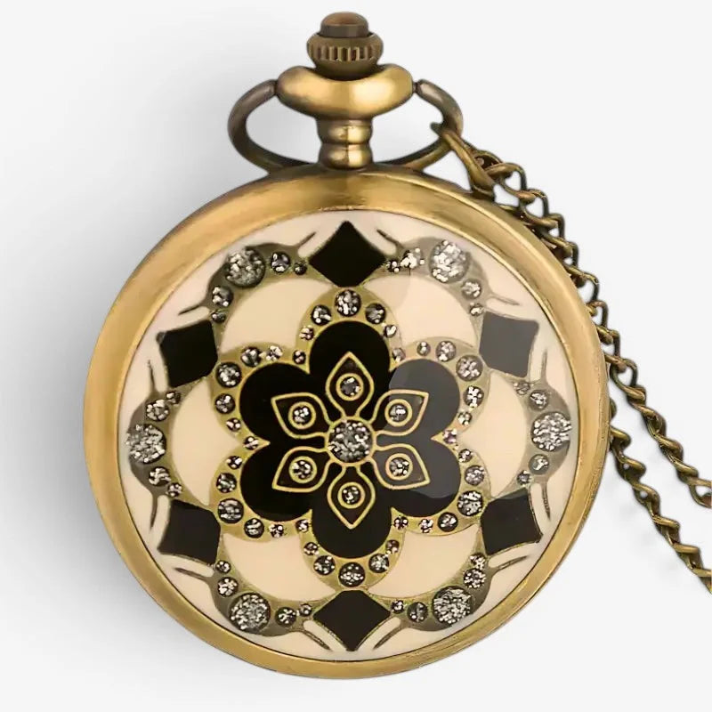 Antique gold-toned ladies flower pocket watch with cream and black floral enamel design and sparkling rhinestones