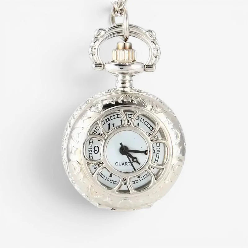 Ladies quartz pocket watch silver ornate design white face black hands with intricate engraved dial details