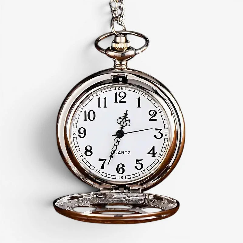 Silver-toned ladies quartz pocket watch with white face black arabic numerals hands and ornate chain attachment