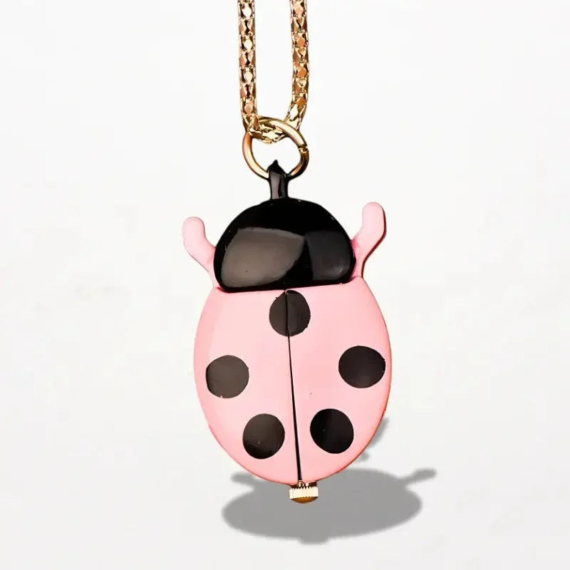 Pink ladybug nurse watch pocket watch with black spots glossy finish hanging from a gold chain