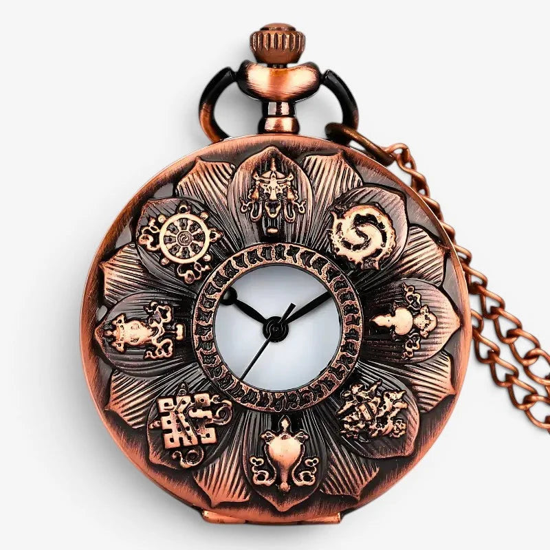 Antique bronze-colored lotus pocket watch with intricate petal design and engraved buddhist symbols on white face