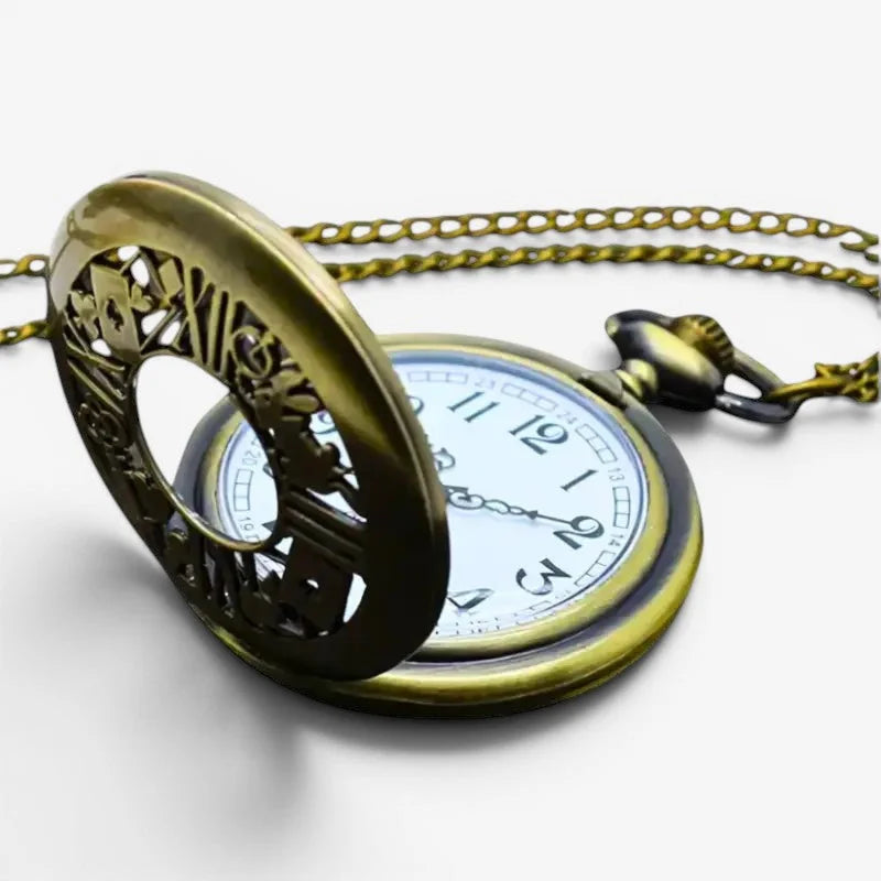Antique brass magic pocket watch with intricate cut-out hinged cover and white face with black numerals