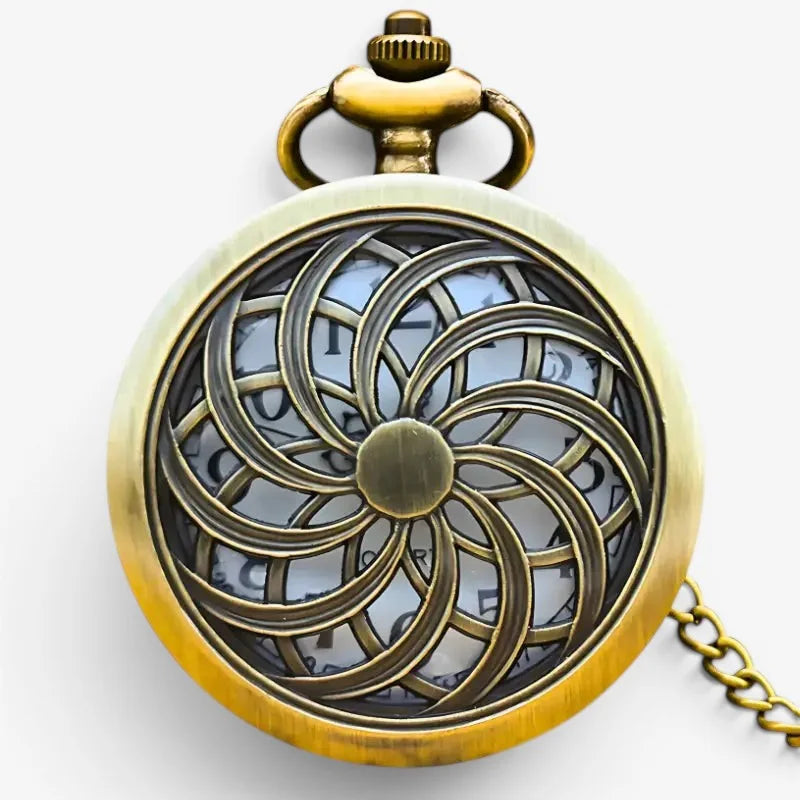 Mandala pocket watch in antique brass with an intricate spiral filigree design and visible clock face through the pattern
