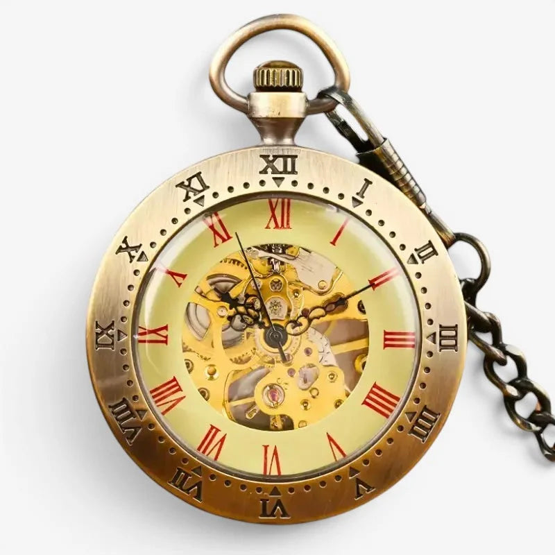 Antique gold-toned manual pocket watch with skeletonized face revealing intricate gears and red roman numerals