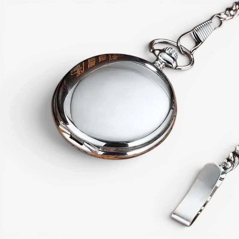 Silver-toned mechanical skeleton pocket watch with polished metallic case, engraved logo bezel, and matching chain
