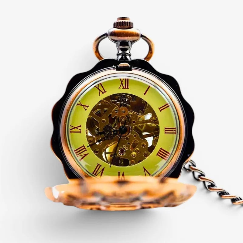 A mechanical steampunk pocket watch with a black scalloped case and gold roman numeral dial revealing gears