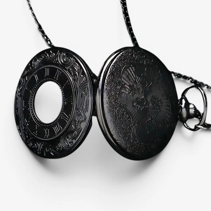 Mens antique pocket watch in black with roman numerals and intricate engravings on both sides suspended from chain