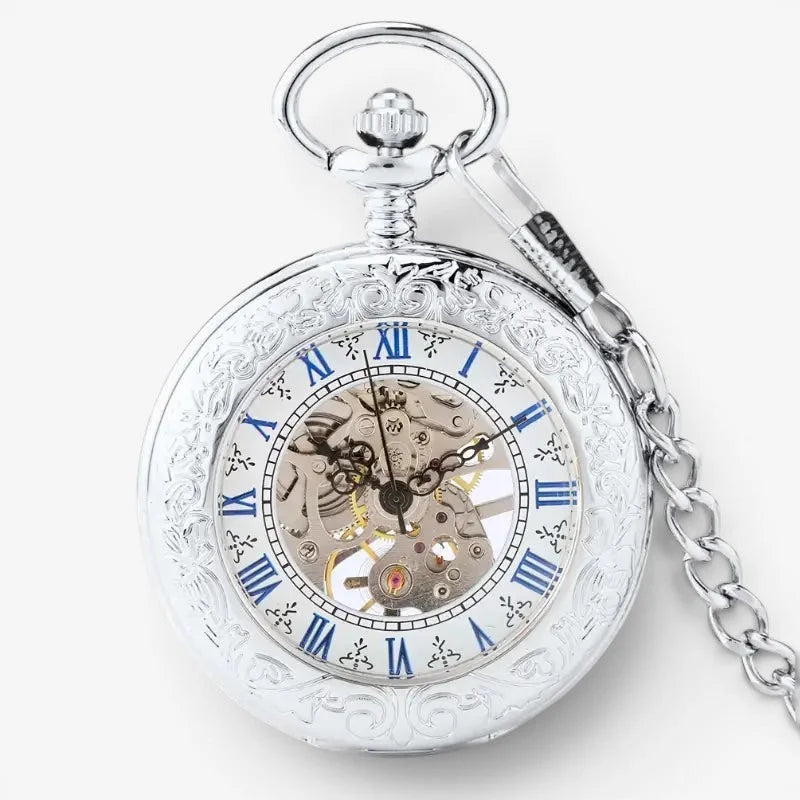 Mens mechanical pocket watch with silver ornate case, blue roman numerals, visible movement, and attached chain