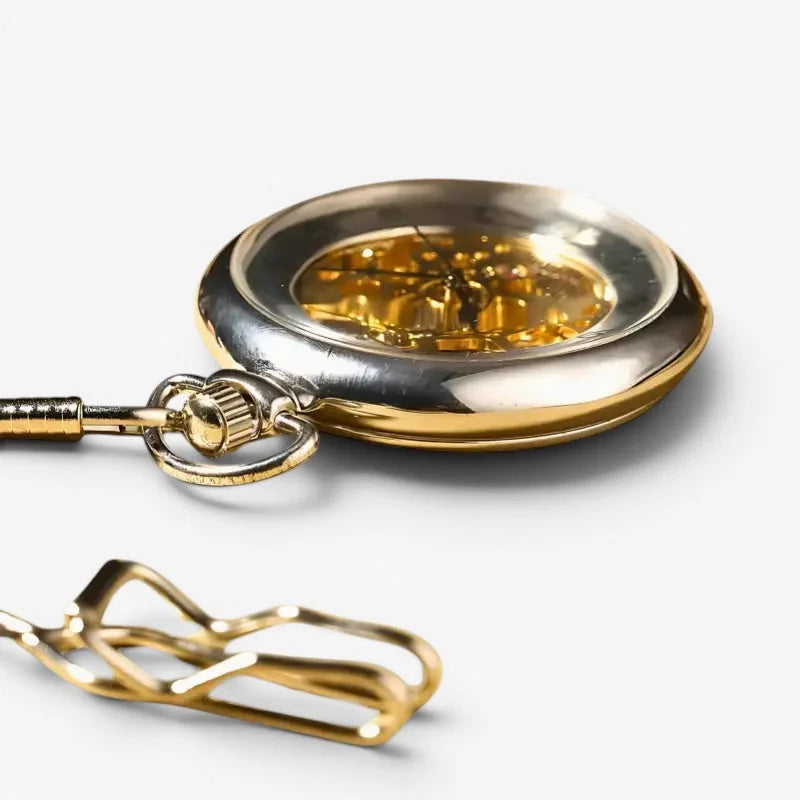 Mens modern pocket watch gold toned with visible mechanical movement and matching chain for stylish timekeeping