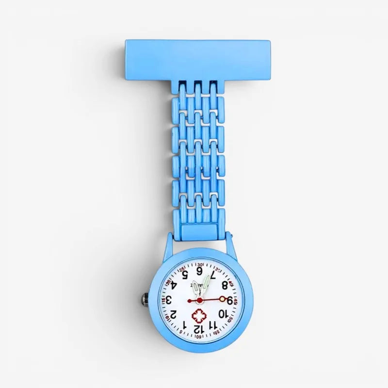 Mens nurse watch light blue plastic with chain fastener white face black numerals red second hand and red cross emblem