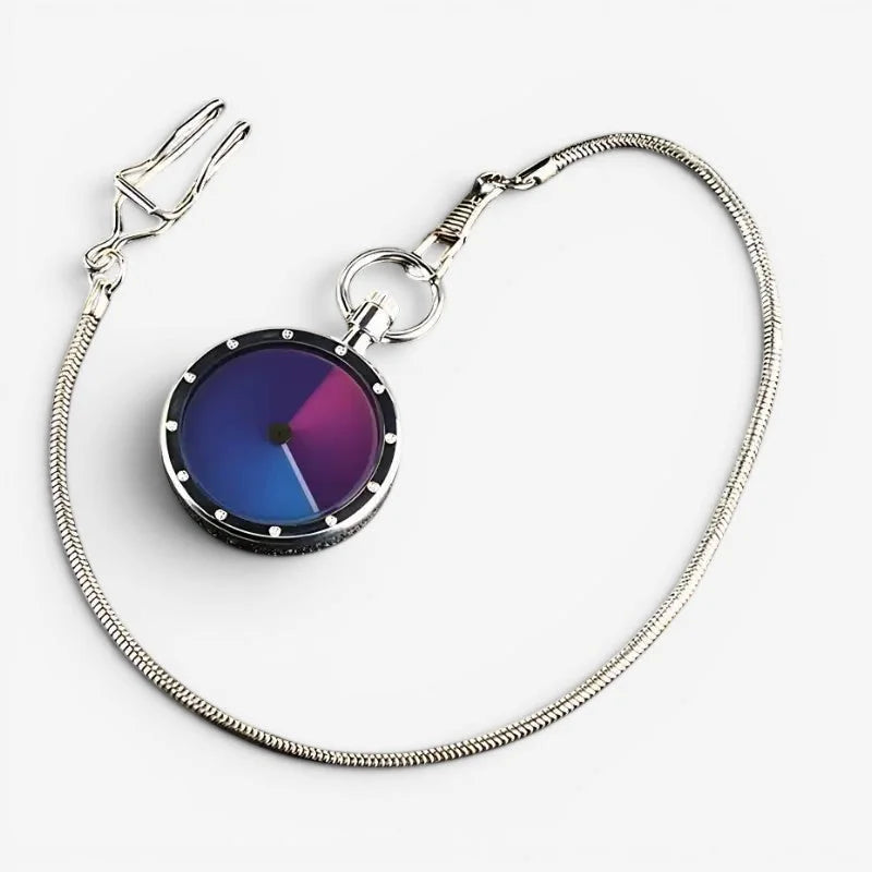 Minimalist pocket watch with silver-tone case, vibrant blue to magenta gradient face, black bezel, and snake-chain strap