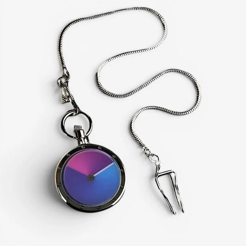 Minimalist pocket watch with a sleek silver-toned metal case and a vibrant pink to blue gradient face with a coiled chain
