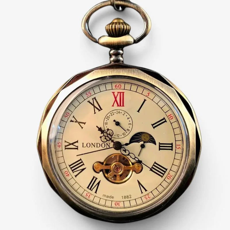 Antique brass-finished moon pocket watch with cream face roman numerals moon phase and visible mechanical gears